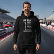 Man wearing a black hoodie with drag racing husband on a race track