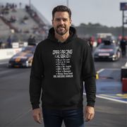 Man wearing a black hoodie with drag racing husband on a race track