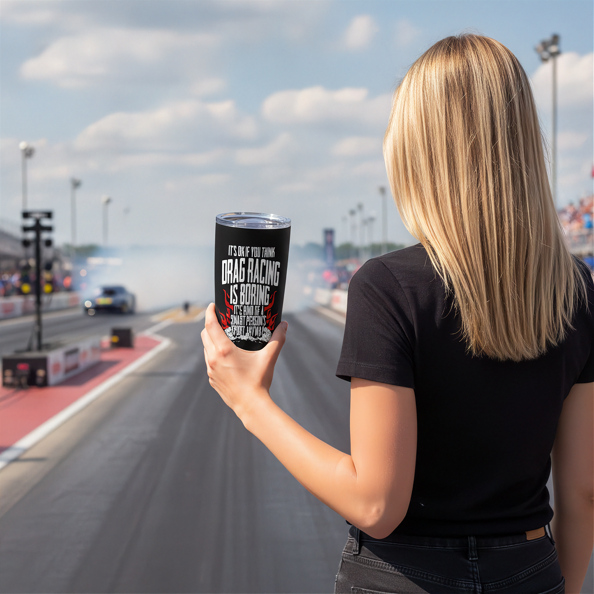 woman in a drag race track holding a drag racing tumbler