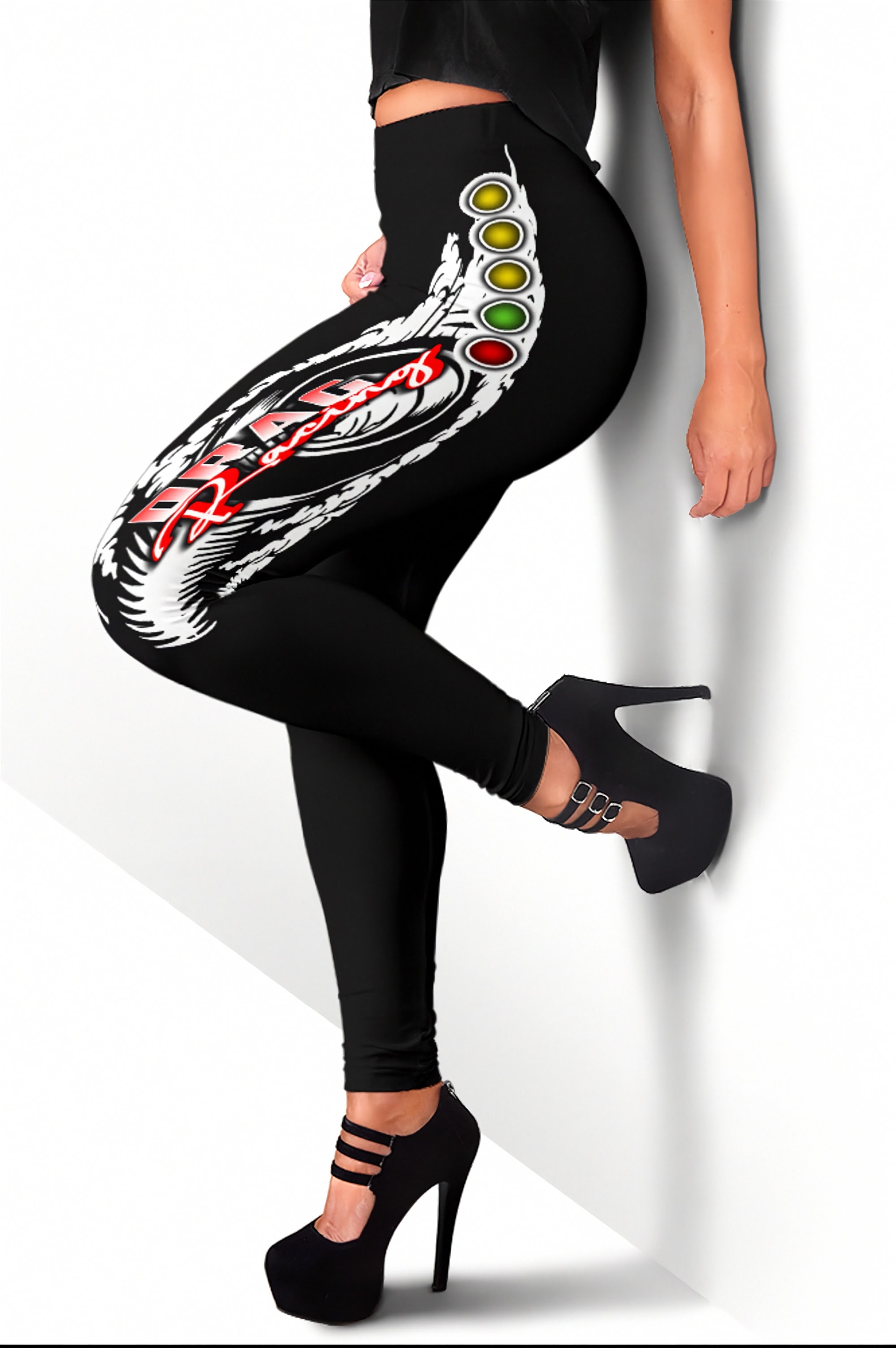 Black leggings with a colorful snake design worn by a person on a white background