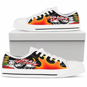 A pair of white low-top canvas sneakers with a vibrant 'Drag Racing' graphic on the side panels. The graphic features orange and yellow flames, a black background, a silver car wheel, and red and white lettering.