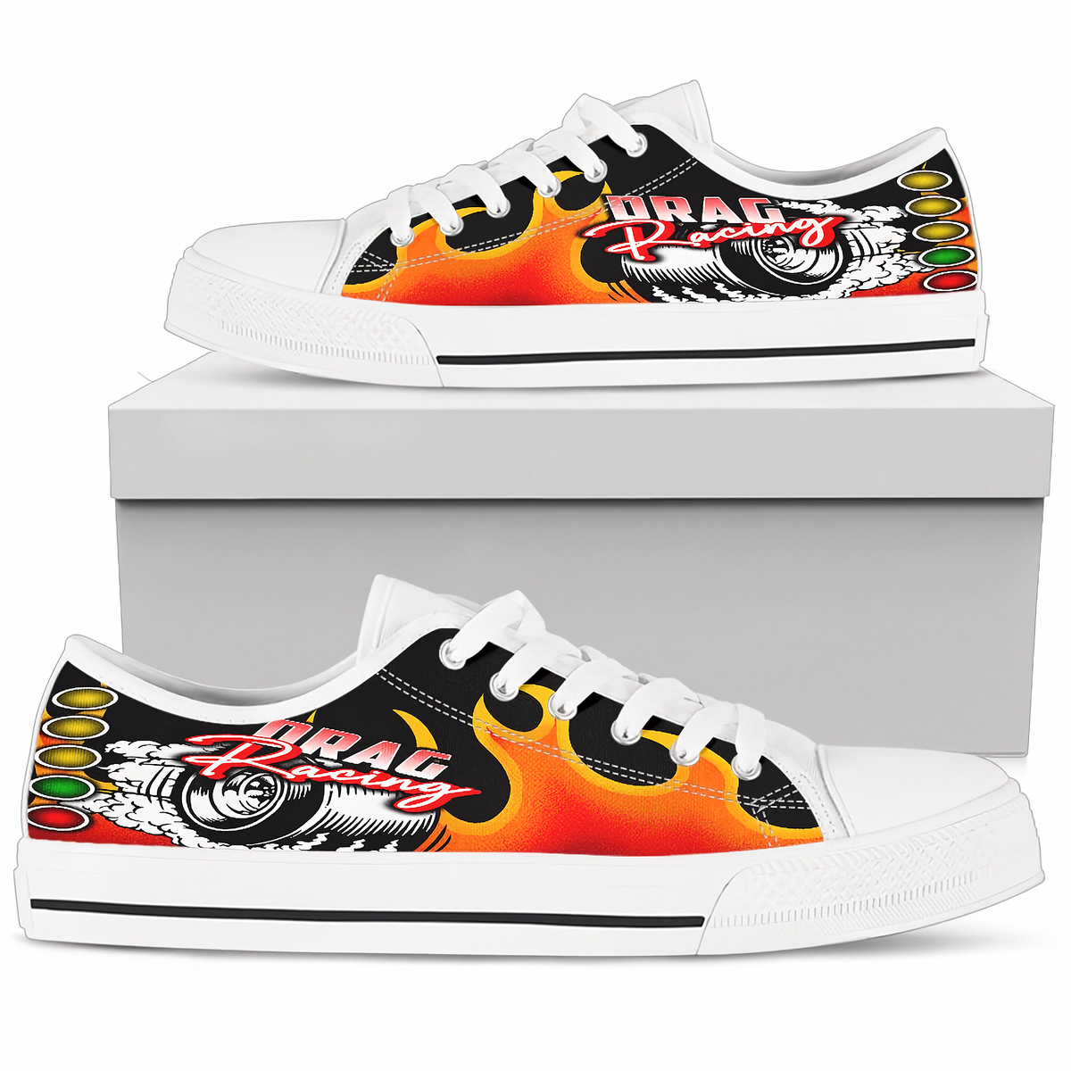 A pair of white low-top canvas sneakers with a vibrant 'Drag Racing' graphic on the side panels. The graphic features orange and yellow flames, a black background, a silver car wheel, and red and white lettering.