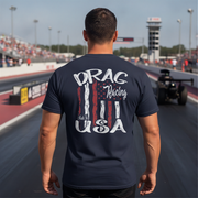 Man wearing a navy blue t-shirt with 'Drag Racing USA' design on a race track.