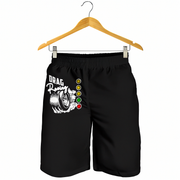 Black athletic shorts with a drag racing graphic and a vertical traffic light design, hanging from a wooden hanger against a white background.