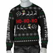 A black Christmas crewneck sweater with a festive holiday pattern, featuring 'HO HO HO' in red text, reindeer, snowflakes, and green zig-zag stripes, shown on a mannequin torso.