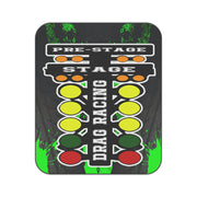 A rectangular drag racing start-light sign with rounded corners, featuring a black background with green paint splatters and white text reading 'PRE-STAGE', 'STAGE', and 'DRAG RACING'. The colored lights include orange, yellow, green, and red.