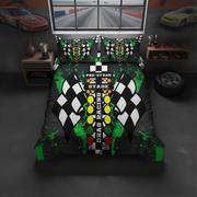 A drad racing-themed bedding set featuring a duvet cover and two matching pillowcases with a black, white, and green checkered pattern, yellow and green track lights, and 'PRE-STAGE RACING STAGE 1' text, shown in a dark room setting.