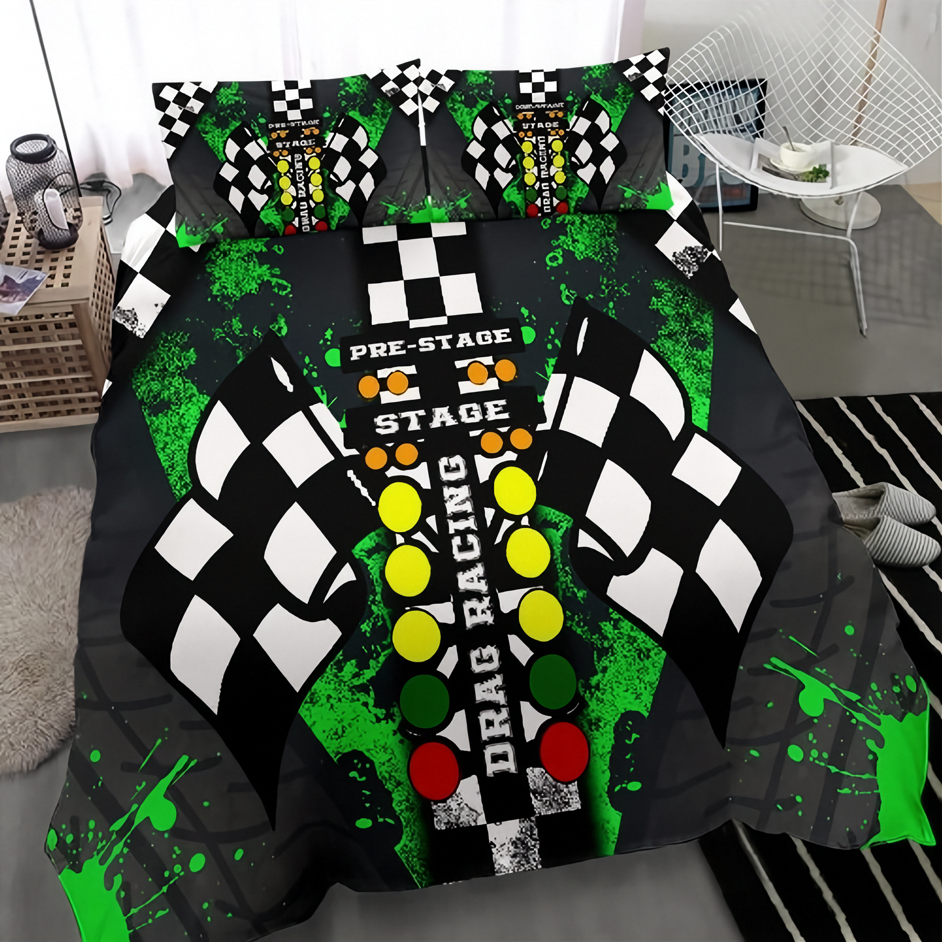 A bedding set featuring a drag racing theme, displayed on a bed in a modern bedroom setting. The set includes a duvet cover and two matching pillowcases with a graphic design of a checkered flag, green paint splatters, and racing lights on a black background.