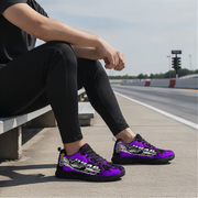 Person sitting on a bench by a road wearing purple sneakers with visible branding.