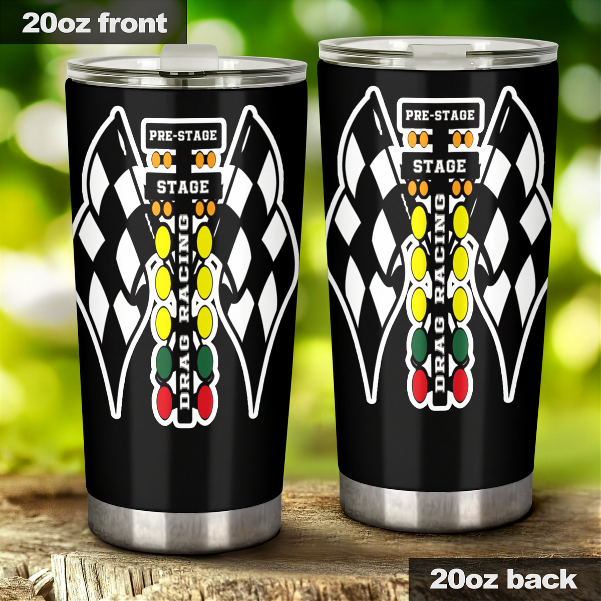 Two 20oz black insulated tumbler cups shown from front and back, featuring a checkered flag and race lights graphic with the words 'PRE-STAGE' and 'STAGE'. The tumbler lids are clear, and the cups are photographed outdoors on a wooden surface with a blurred green background.