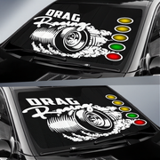 Car sun visor with drag racing design featuring a turbocharger and traffic lights.