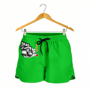 Bright green athletic shorts with a black drawstring and a 'Drag Racing' graphic on the left leg, hanging from a wooden hanger against a white background.