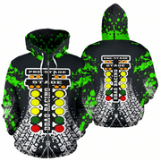 Front and back views of a black pullover hoodie featuring a drag racing theme with neon green splatter graphics, a yellow, green, and red light sequence graphic, and white tire-track style patterns near the hem.