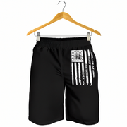 Black athletic shorts with a distressed white American flag graphic and the words 'EAT SLEEP DRAG RACING REPEAT' hanging from a wooden hanger against a white background.