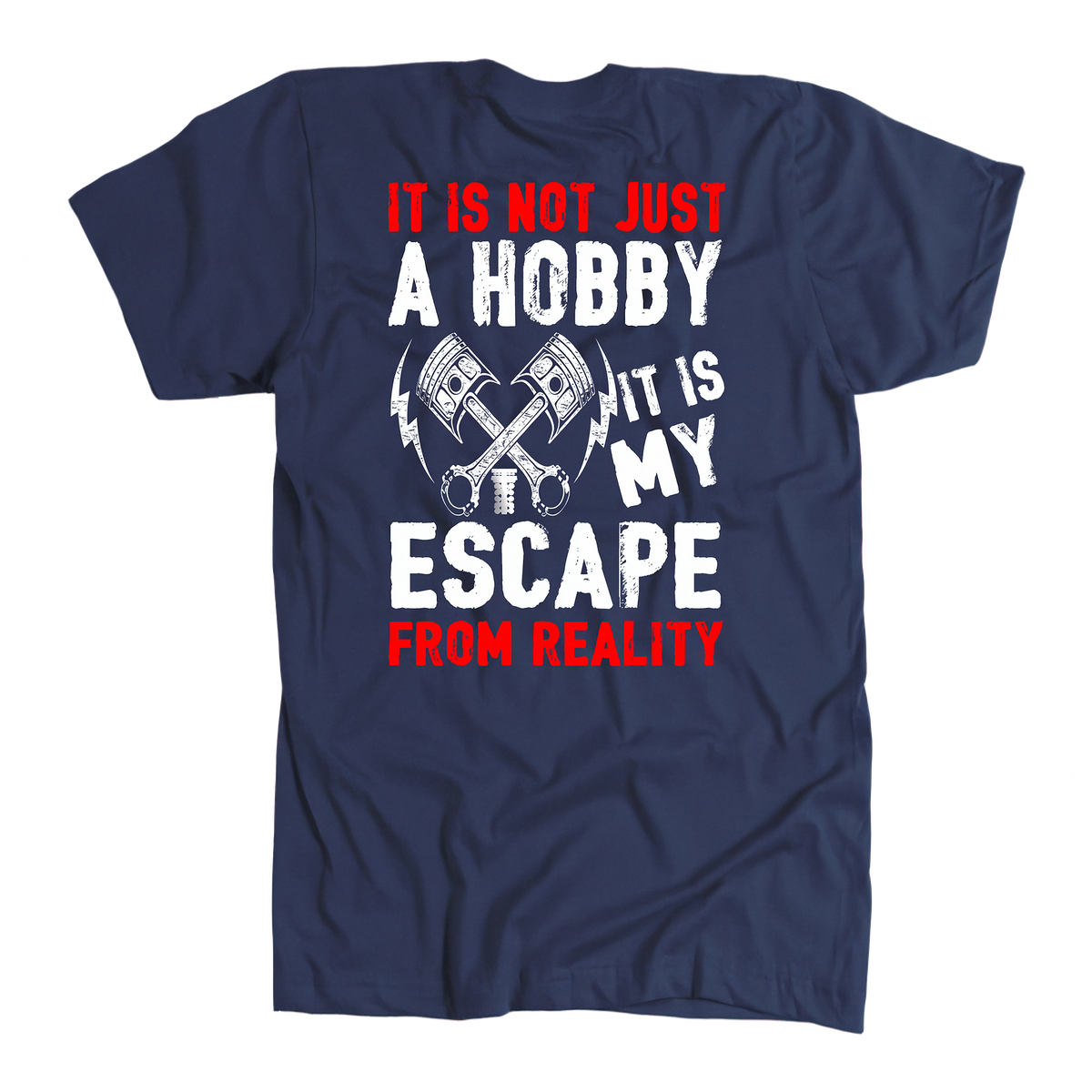 A navy blue short-sleeve t-shirt with a graphic print on the front. The design features the text 'IT IS NOT JUST A HOBBY IT IS MY ESCAPE FROM REALITY' in white and red lettering, accompanied by an illustration of crossed pistons and sparklers.