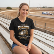 Woman wearing a black t-shirt with racing graphic at a race track.