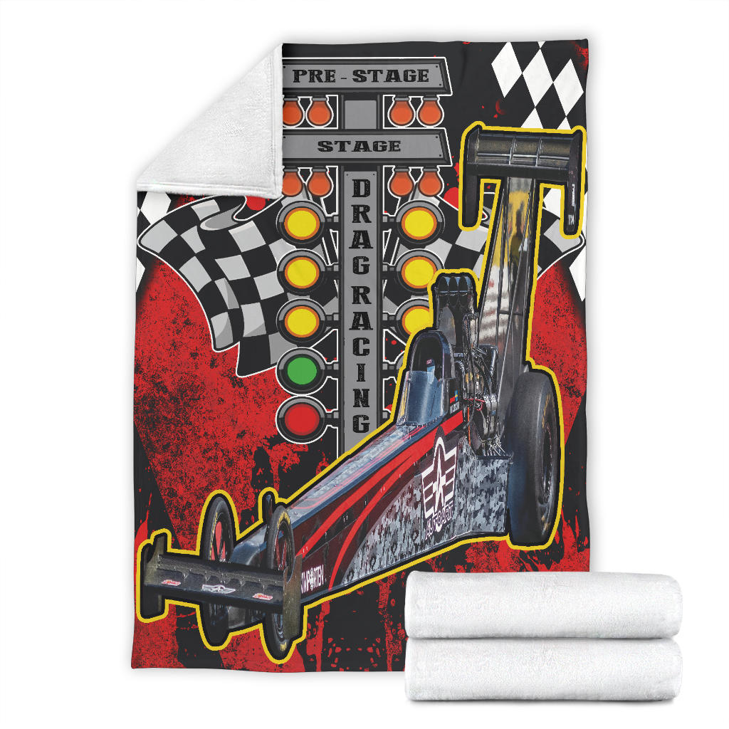 Full view of the dragster photo blanket with a folded corner showing white microfleece backing.