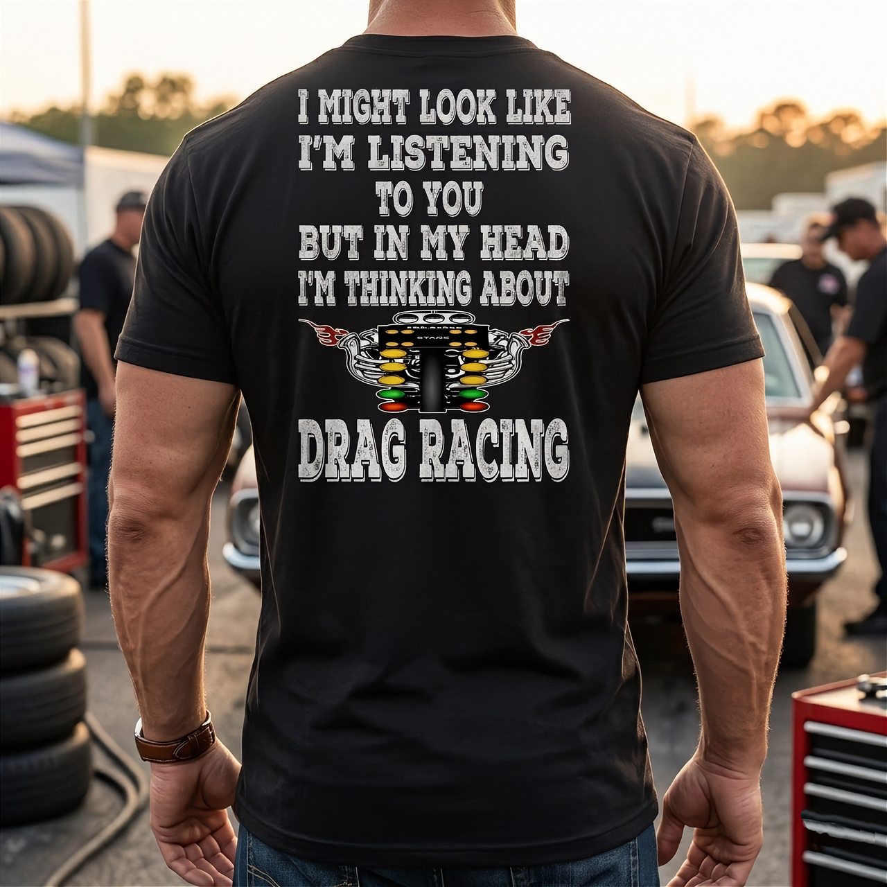Funny drag racing apparel featuring the quote "I Might Look Like I'm Listening To You", available in premium slim-fit tees, tanks, crewneck sweatshirts, and heavy-duty hoodies.