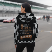 Woman wearing a sherpa hoodie with racing text on the back at a race track
