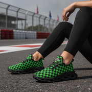 Woman wearing green and green checkered shoes on a race track