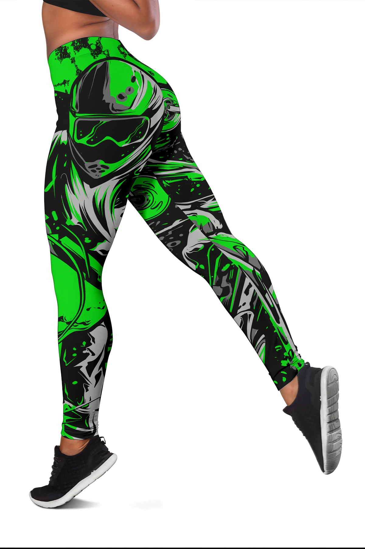 A person wearing high-waisted leggings with a bold green, black, and gray graphic print featuring a stylized helmeted figure, shown from the waist down against a plain white background.
