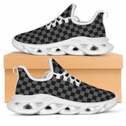 Black and gray checkered shoes with white soles on a beige box