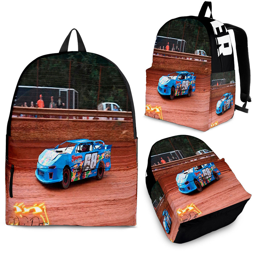 High-performance school and track backpack featuring a vibrant custom black and blue dirt late model racing car graphic, engineered with adjustable ergonomic shoulder straps and a breathable padded mesh back panel.