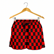 High-performance women's athletic shorts featuring a bold red and black checkered pattern, designed with an elastic drawstring waist and functional side pockets.