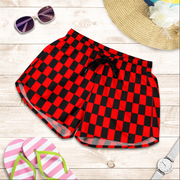 High-performance women's athletic shorts featuring a bold red and black checkered pattern, designed with an elastic drawstring waist and functional side pockets.