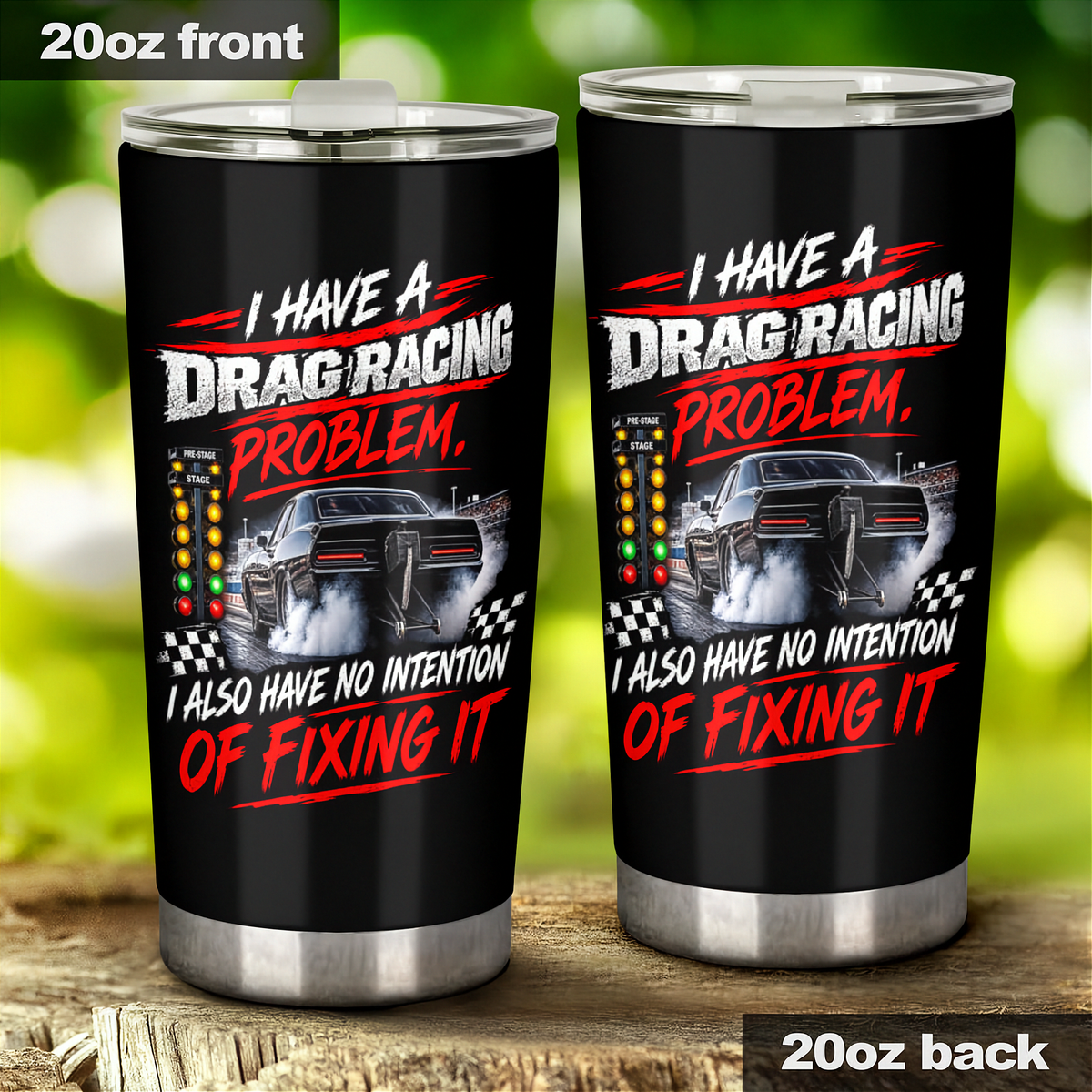 Two 20oz black insulated tumbler cups shown front and back on a wooden surface with a blurred green outdoor background. The cups feature a drag racing graphic with a black car, checkered flags, and bold red and white text reading, 'I HAVE A DRAG RACING PROBLEM.