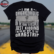 Black t-shirt with white text on a blurred drag racing track background