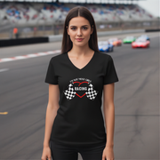 Woman wearing a black t-shirt with racing design on a race track background
