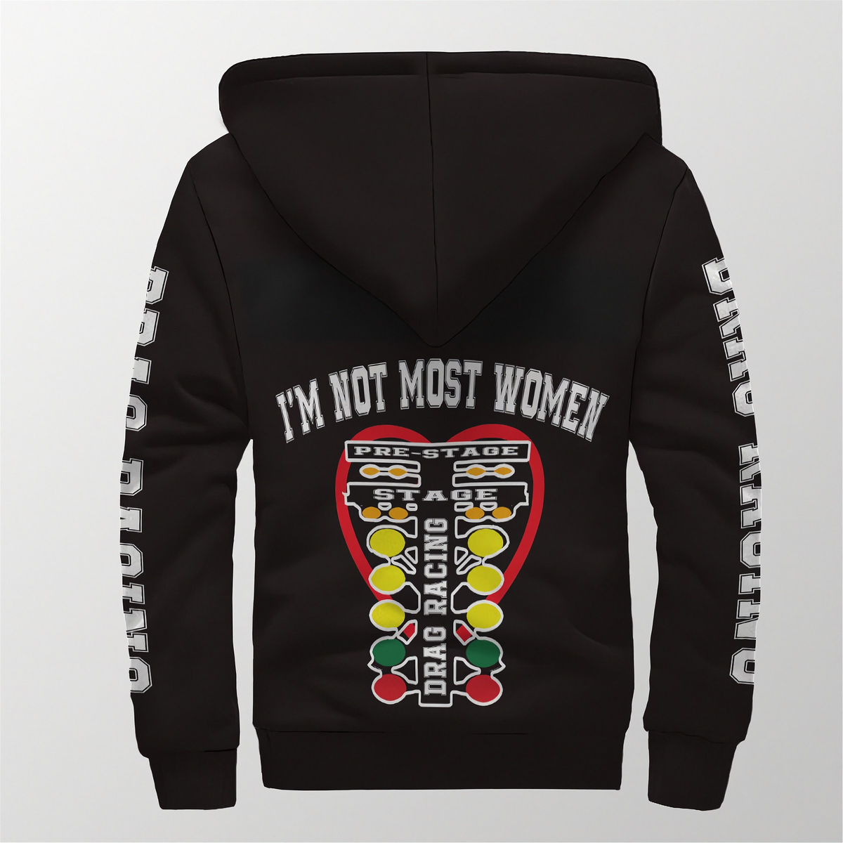 A black pullover hoodie shown from the back, featuring a large graphic print with the text 'I'M NOT MOST WOMEN' above a drag racing headlight design in red, yellow, green, and white. White text runs down both sleeves.