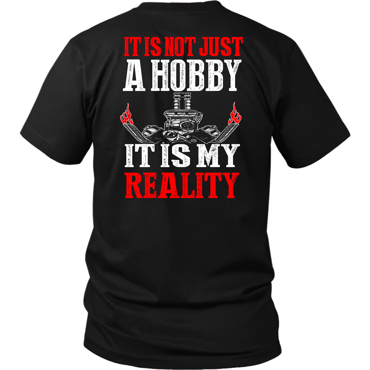 A black short-sleeve t-shirt shown from the back, featuring a bold graphic print with the text 'IT IS NOT JUST A HOBBY IT IS MY REALITY' in red and white, flanking a white skull and grill graphic with red flames.