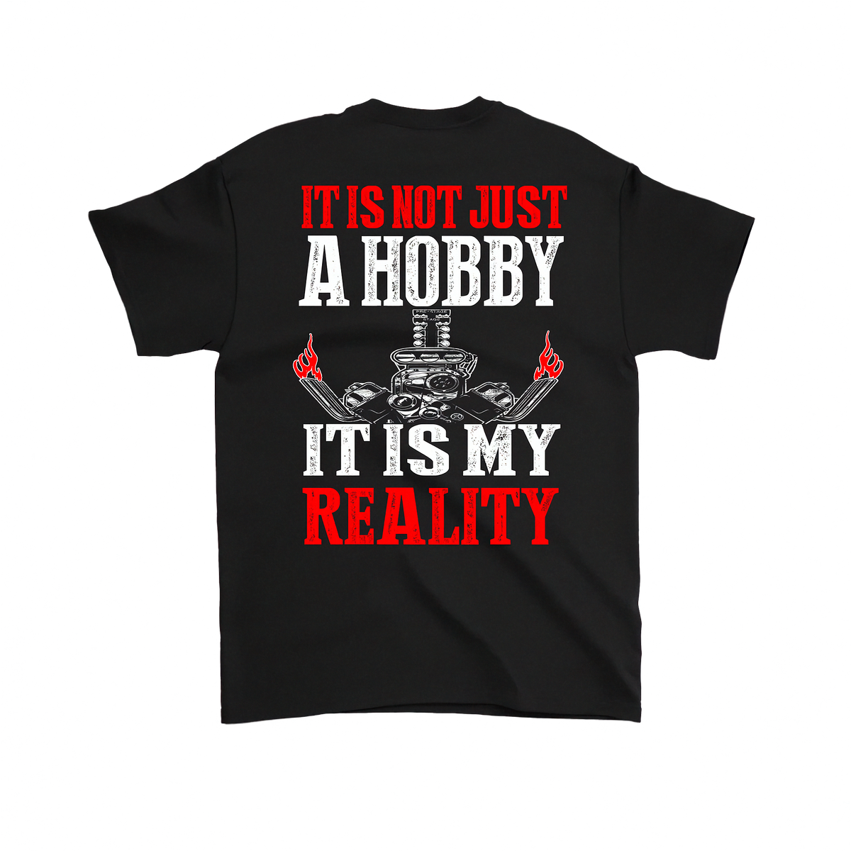 A black short-sleeve t-shirt shown from the back, featuring a bold graphic print with the text 'IT IS NOT JUST A HOBBY IT IS MY REALITY' in red and white distressed lettering, flanking a skull and crossed tools graphic.