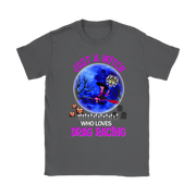 A dark gray crewneck t-shirt featuring a colorful graphic print of a witch riding a red dragon over a graveyard in front of a blue full moon, with the text 'JUST A WITCH WHO LOVES DRAG RACING' in pink and white.