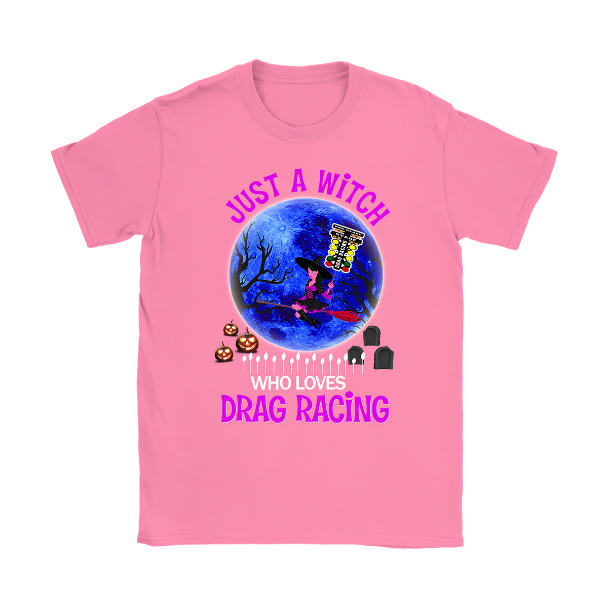 A pink short-sleeve crewneck t-shirt featuring a Halloween-themed graphic print. The design shows a witch riding a broom over a blue full moon with a yellow cauldron, surrounded by jack-o'-lanterns, tombstones, and the text 'JUST A WITCH WHO LOVES DRAG RACING' in pink and white lettering.