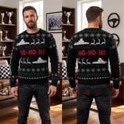 A man is shown from the front and back wearing a black Christmas sweater with green and white festive patterns and red 'HO-HO-HO' text, standing in a living room with trophies and furniture in the background.