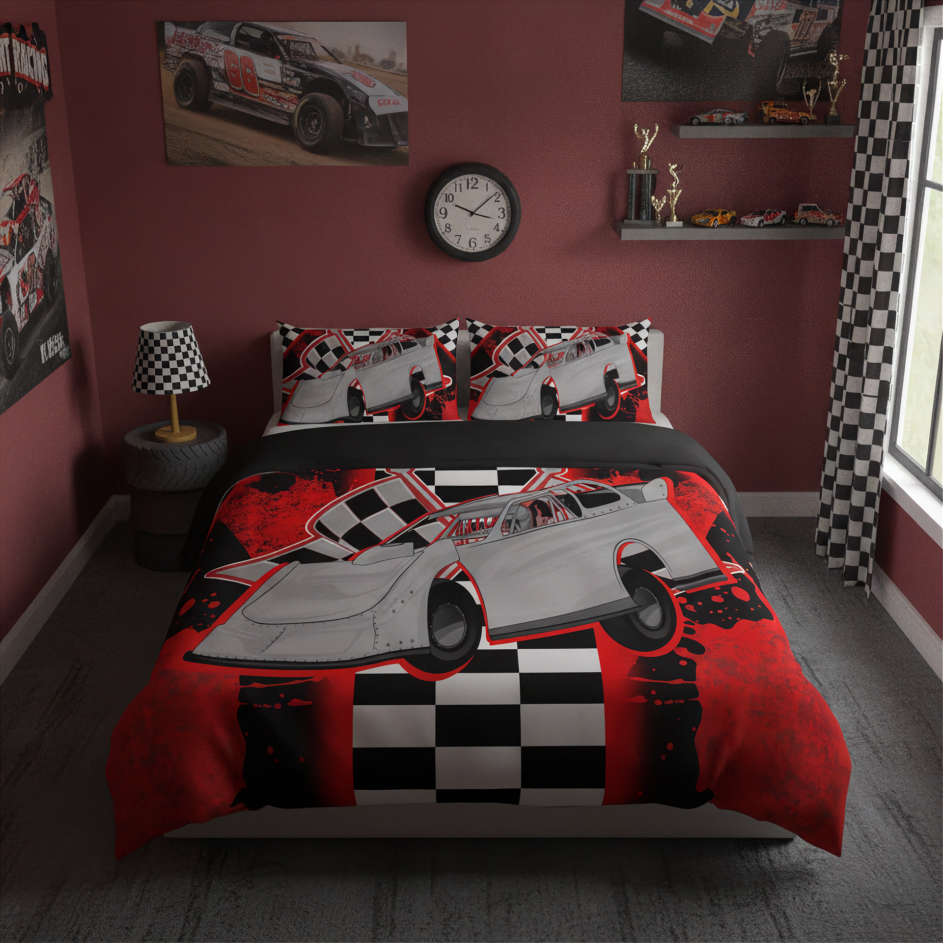 A racing-themed bedding set featuring a late model race car and checkered flag pattern, displayed on a bed in a styled bedroom with red walls and racing decor.
