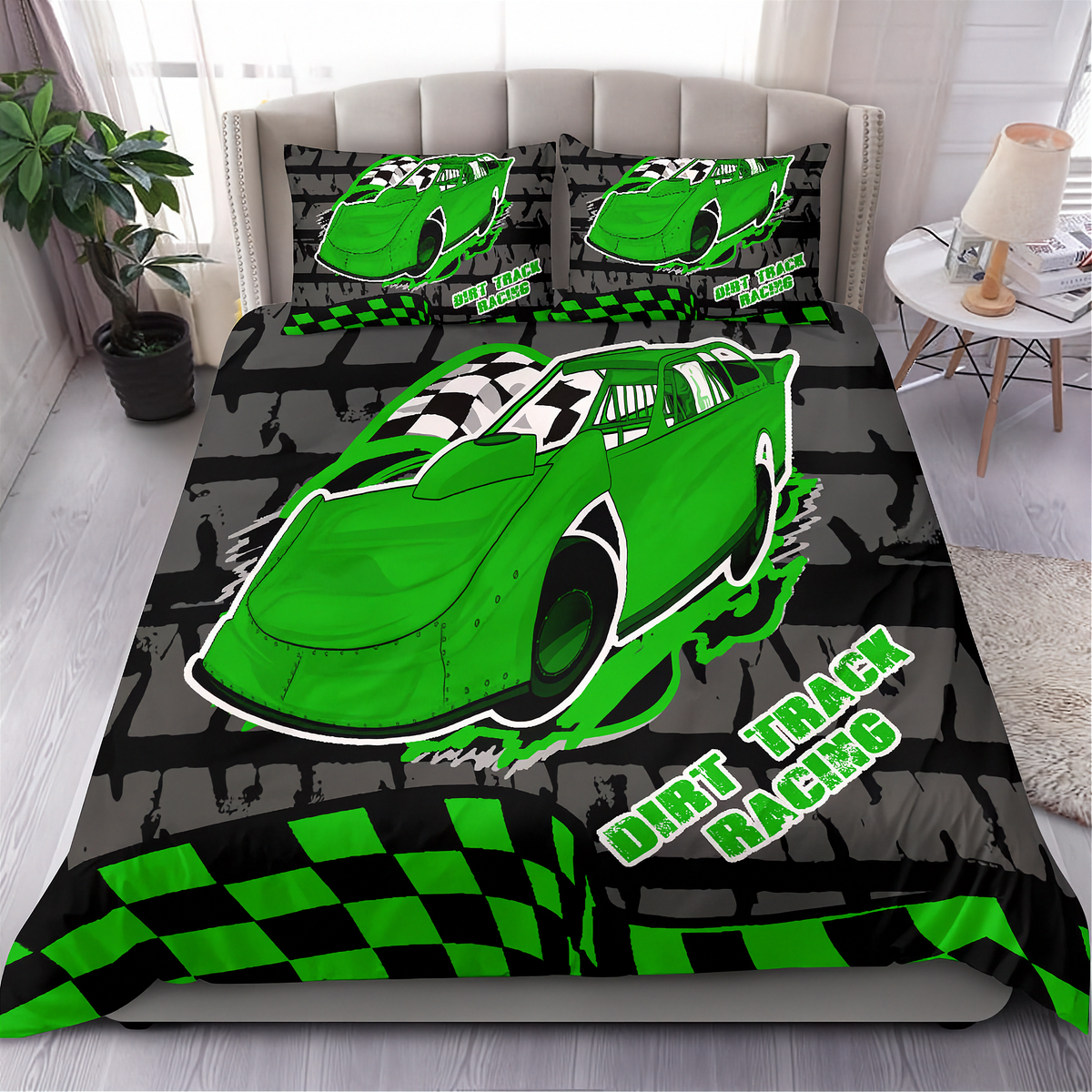 A racing-themed bedding set displayed on a bed in a bedroom setting, featuring a green dirt track race car, checkered flag patterns, and the text 'DIRT TRACK RACING' on the comforter and matching pillowcases.