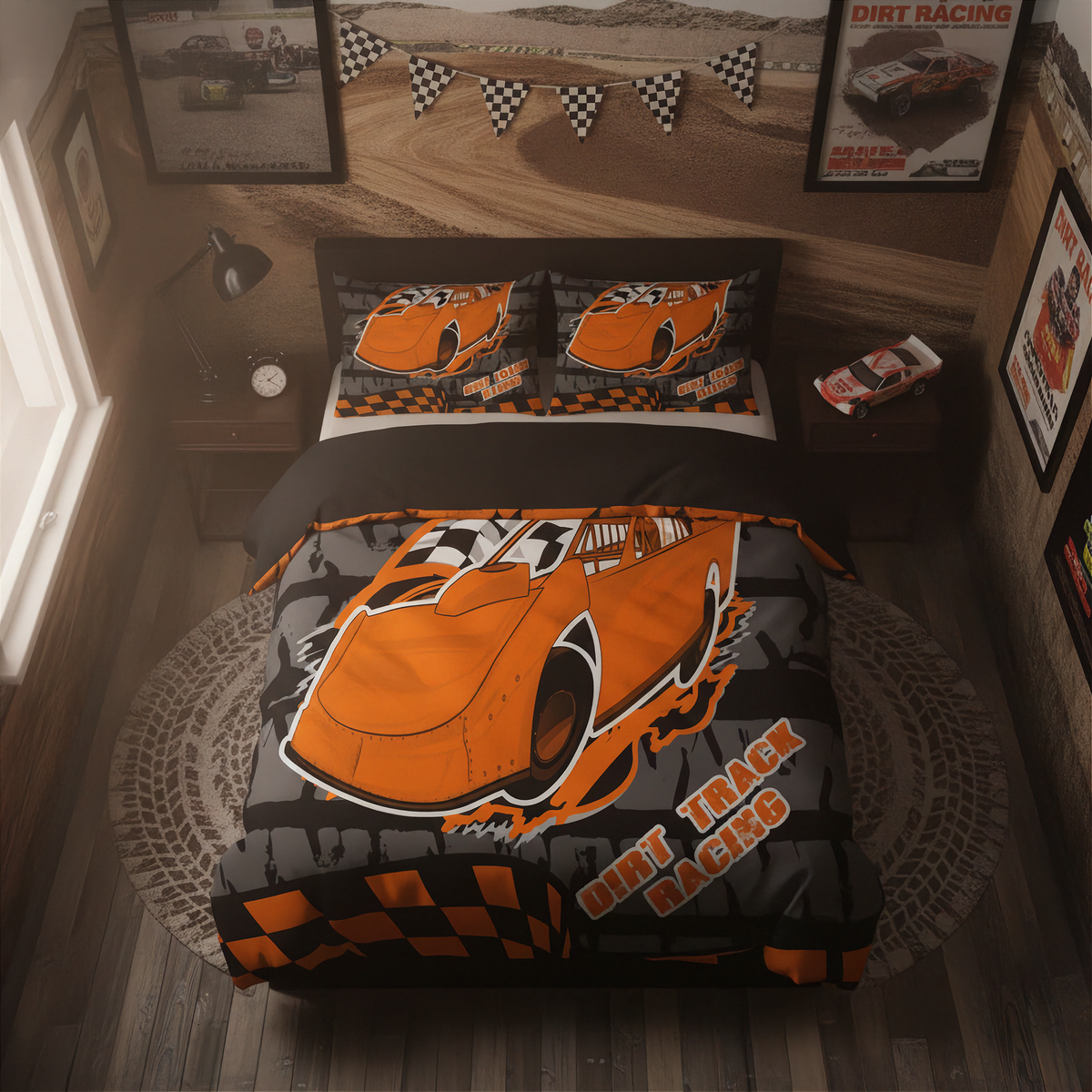 A children's bed dressed in a racing-themed bedding set featuring a large orange race car graphic, black and gray checkered patterns, and 'Dirt Track Racing' text, shown in a styled bedroom with racing posters and decor.