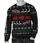 A mannequin wearing a black Christmas sweater with a festive knit pattern featuring snowflakes, green zigzags, white reindeer, red cars, and red 'HO - HO - HO' text across the chest.