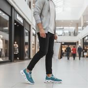 Man wearing blue and white checkered sneakers in a shopping mall.