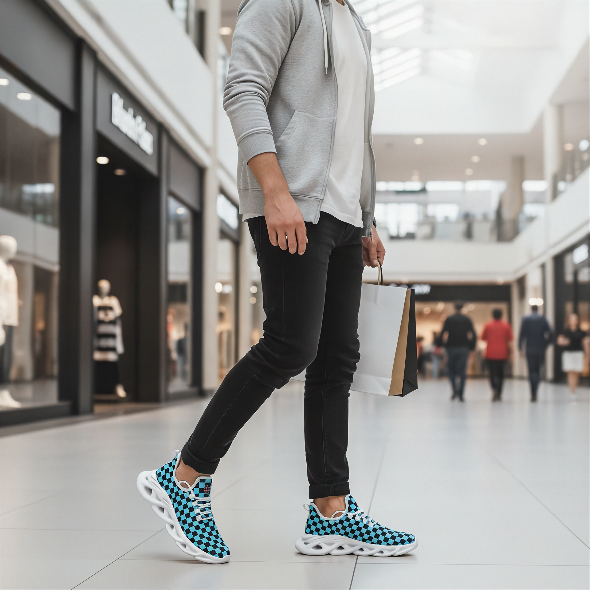 Man wearing blue and white checkered sneakers in a shopping mall.