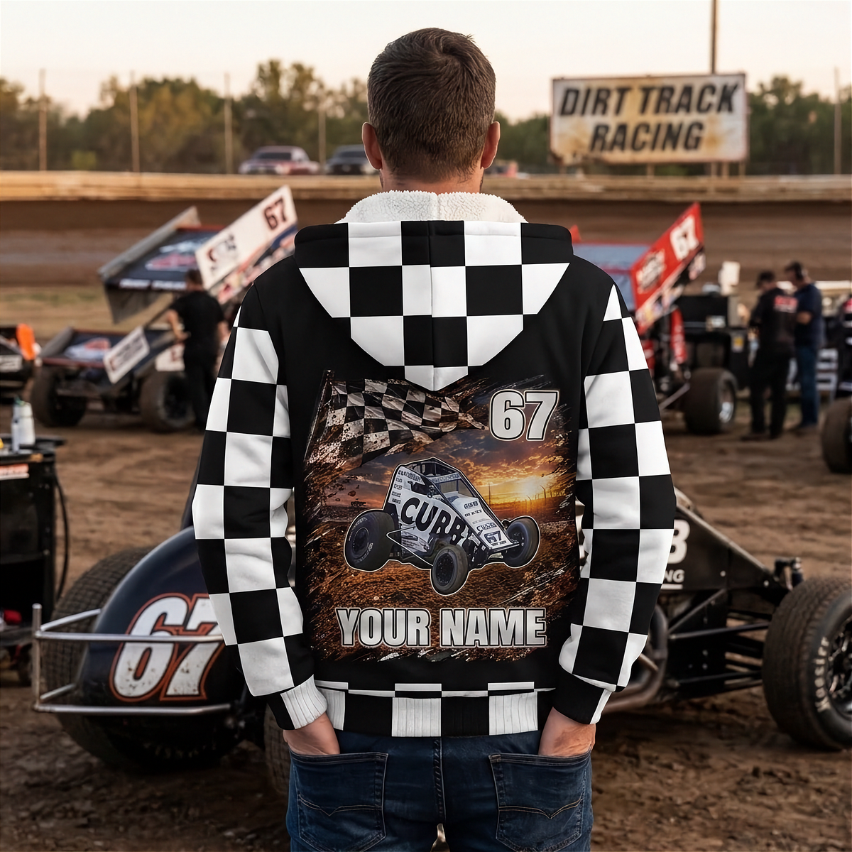 Man in the racing pits wearing a personalized non-wing sprint car jacket, showing the car, name, and number back design.