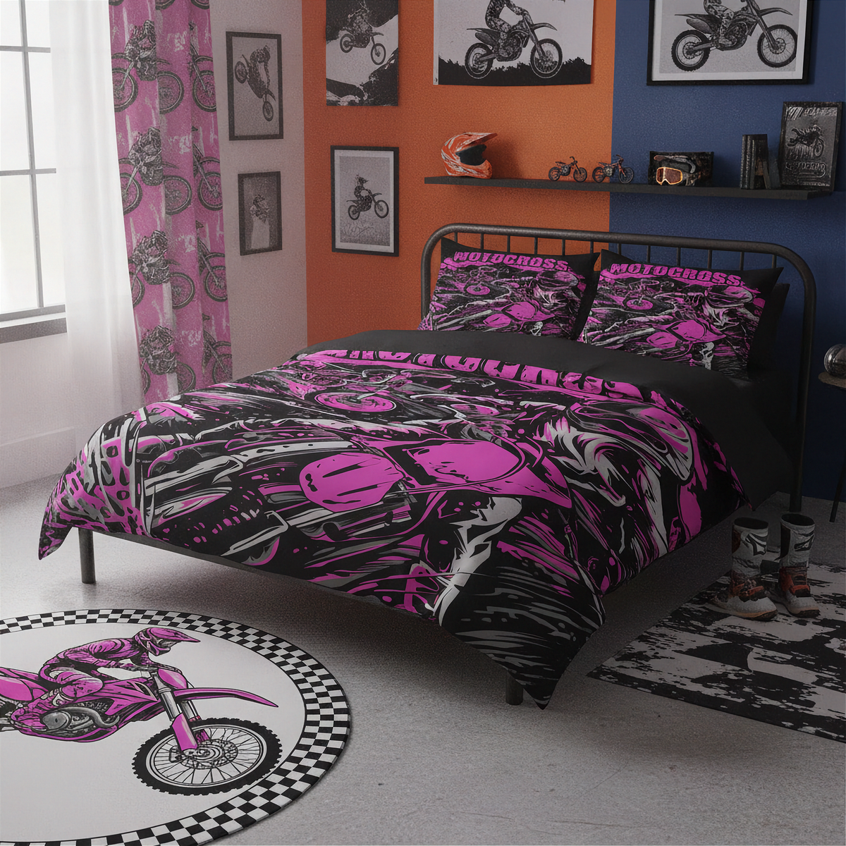 A bed dressed in a pink, black, and white graphic motorcycle-themed bedding set, shown in a styled bedroom with orange and blue walls, framed bike prints, a patterned rug, and a matching motorcycle rug.
