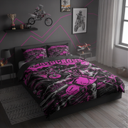 A motorcycle-themed bedding set with a duvet cover and two matching pillowcases, displayed on a bed in a modern gray bedroom. The bedding features a vibrant pink and black graphic print of a motorcycle and the word 'MOTOCYCLING'.