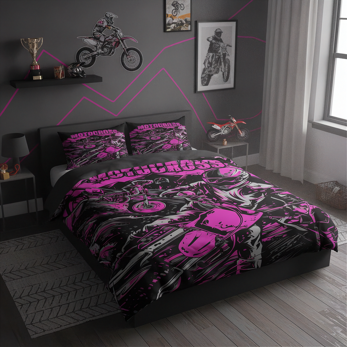 A motorcycle-themed bedding set with a duvet cover and two matching pillowcases, displayed on a bed in a modern gray bedroom. The bedding features a vibrant pink and black graphic print of a motorcycle and the word 'MOTOCYCLING'.