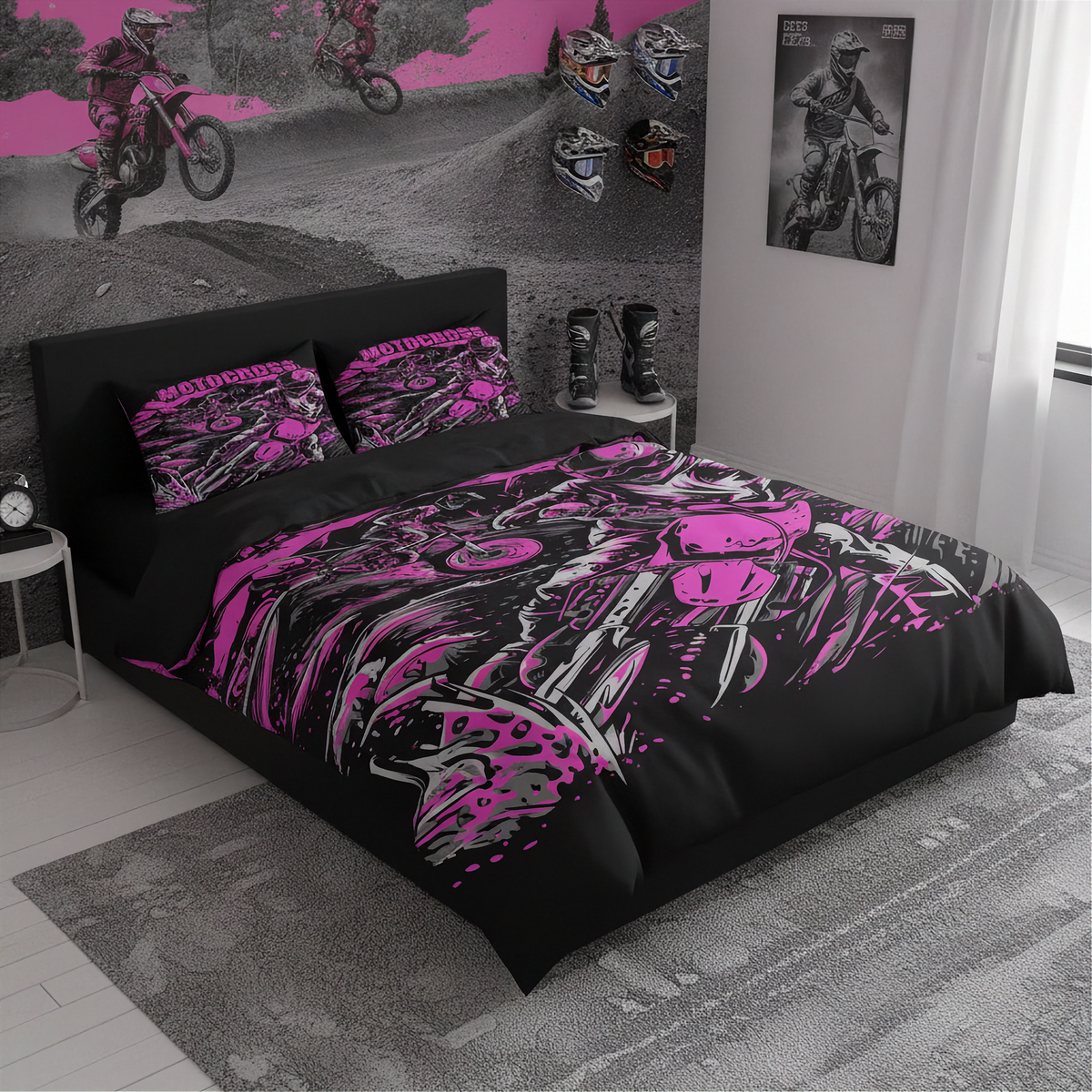 A bed dressed in a black motocross-themed bedding set with bright pink and gray graphic print, shown in a styled bedroom with matching wall art, posters, boots, and a rug.