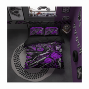 A motorcycle-themed bedding set displayed on a bed in a styled bedroom. The set includes a duvet cover and two pillowcases featuring a detailed graphic print of a purple and black motorcycle with the word 'MOTOCROSS' on the pillows.